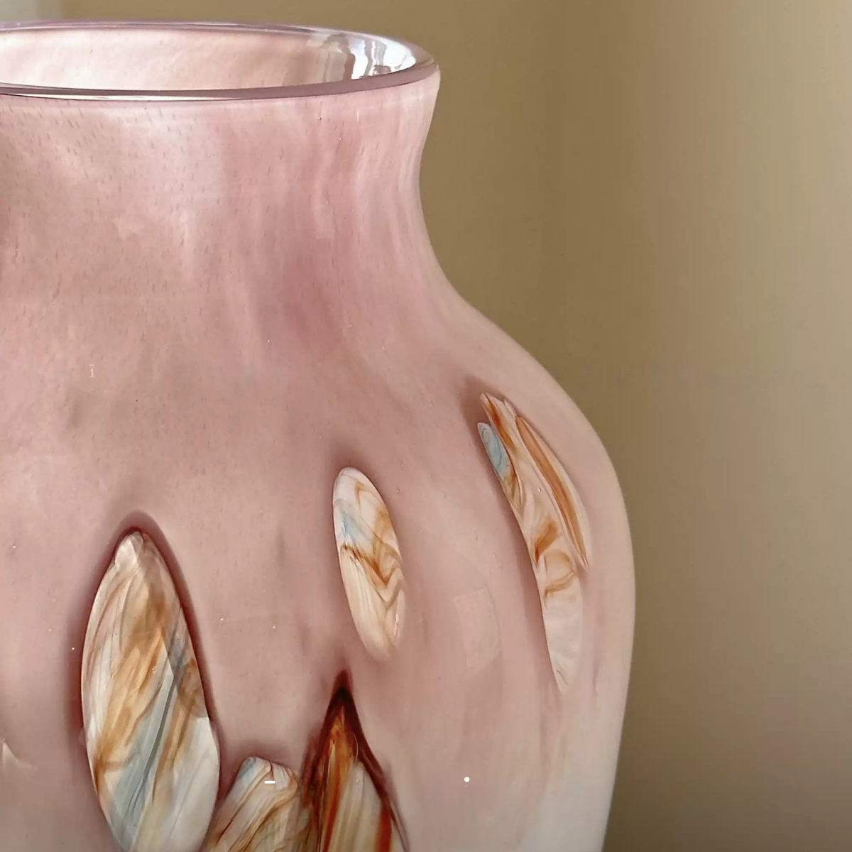 handmade glass vase with gentle pink hue and smooth curves
