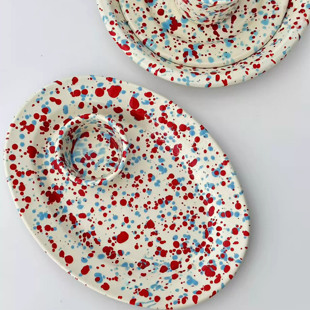 glossy enamel plates with bold color splashes