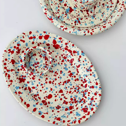 glossy enamel plates with bold color splashes