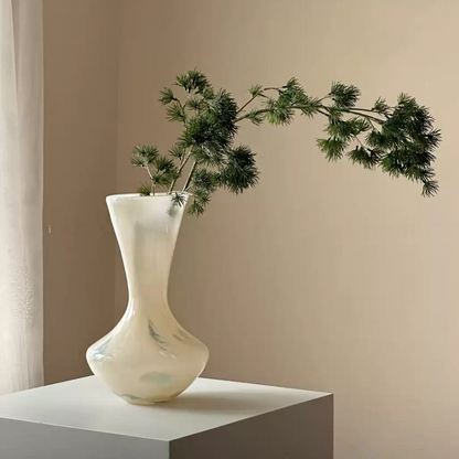 curved glass vase allowing natural flower placement