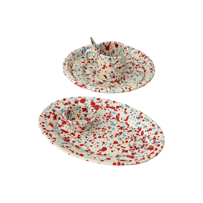 colorful enamel plates with dopamine red and blue splatter design
