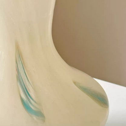 translucent pink glass vase with soft light reflections