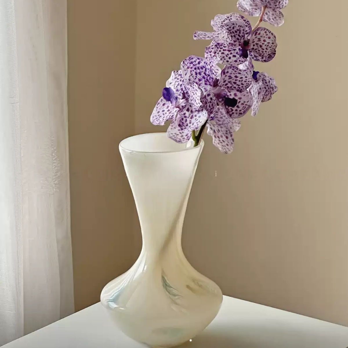 modern sculptural glass vase for floral arrangement