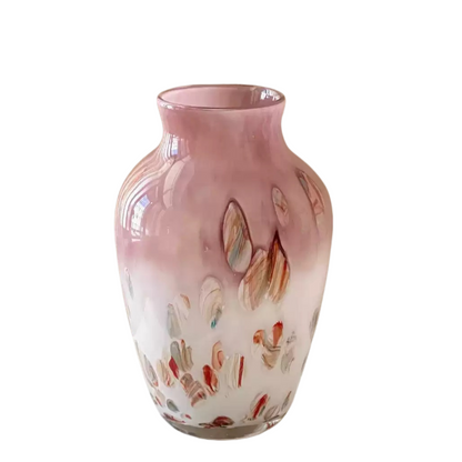 translucent blush glass vase diffusing natural light